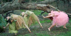 Lindsey Stirling dancing with nymphs in the forest in her "Lost Girls" video