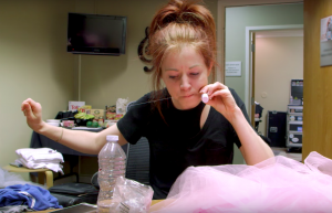 Lindsey Stirling fixing a costume