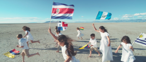 Children carrying Latin American flags in Spanish cover of "The Prayer"