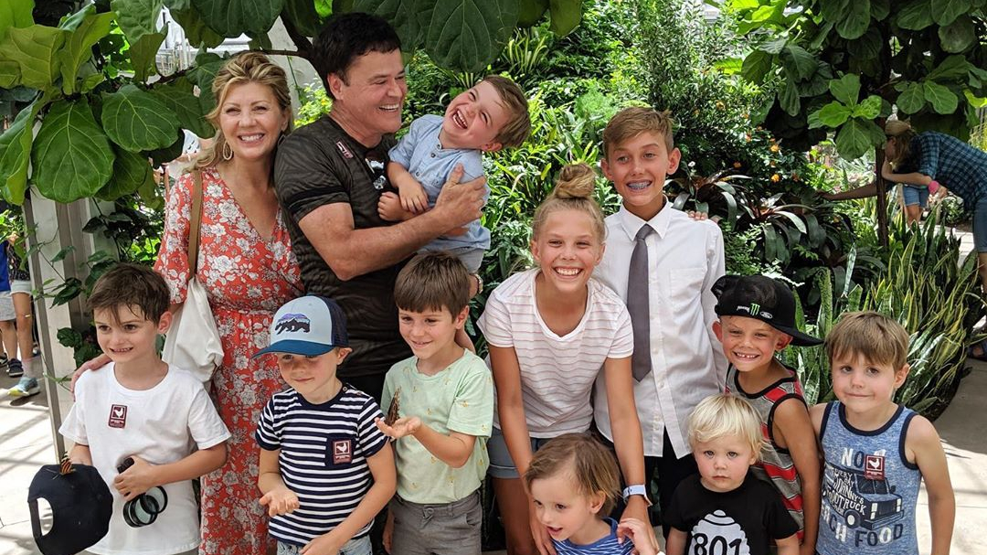 Donald Clark Osmond, his wife Debbie, and their grandkids